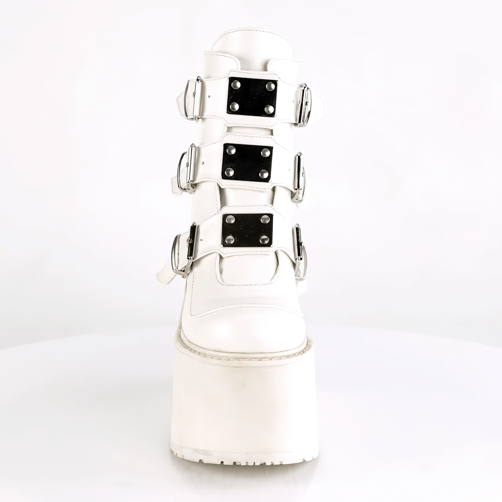 Demonia white wedge platform ankle boots featuring triple buckle straps and a sleek 5 1/2-inch heel.