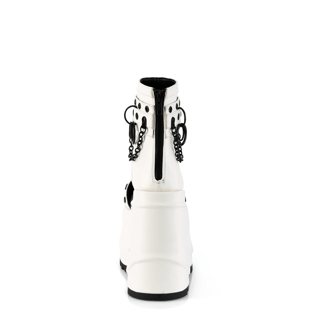 Back view of DEMONIA white wedge platform booties featuring chains and O-rings for a punk aesthetic.