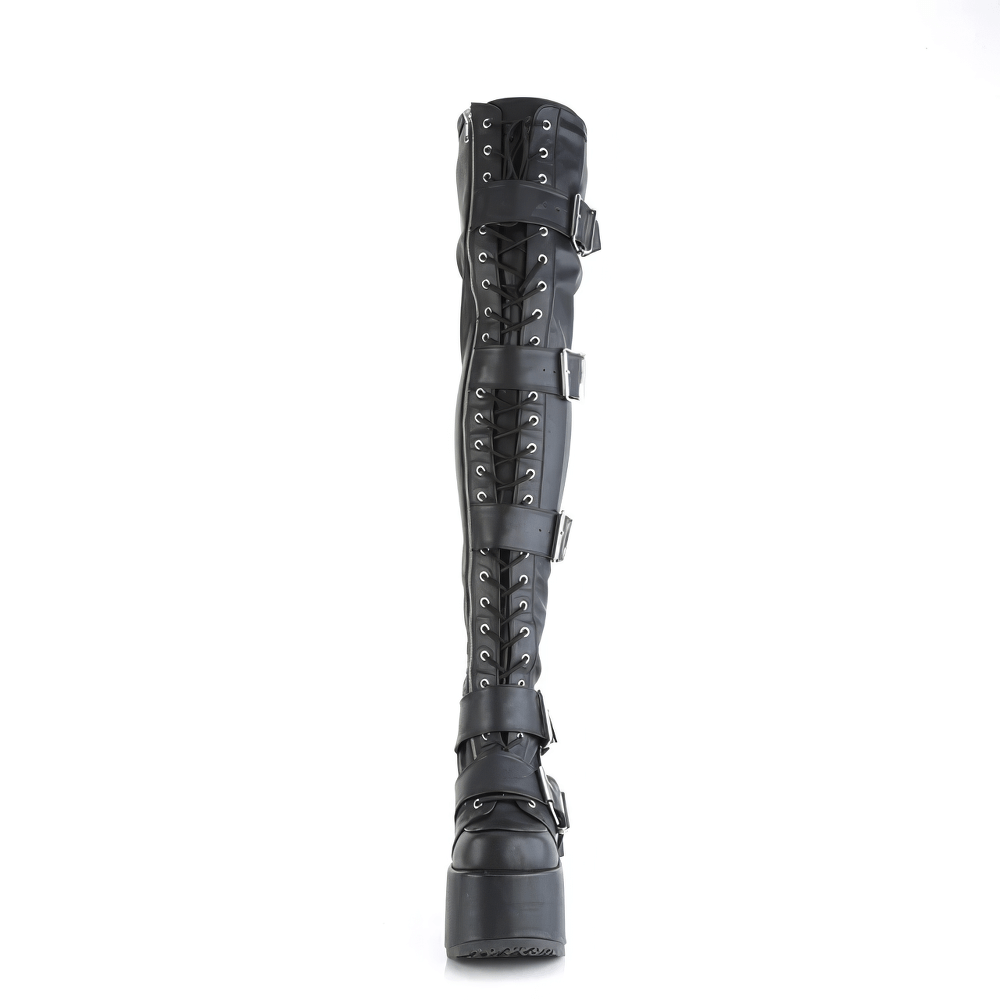 Daring DEMONIA thigh-high black leather boots with lace-up front and buckle straps, featuring a chunky heel and platform.
