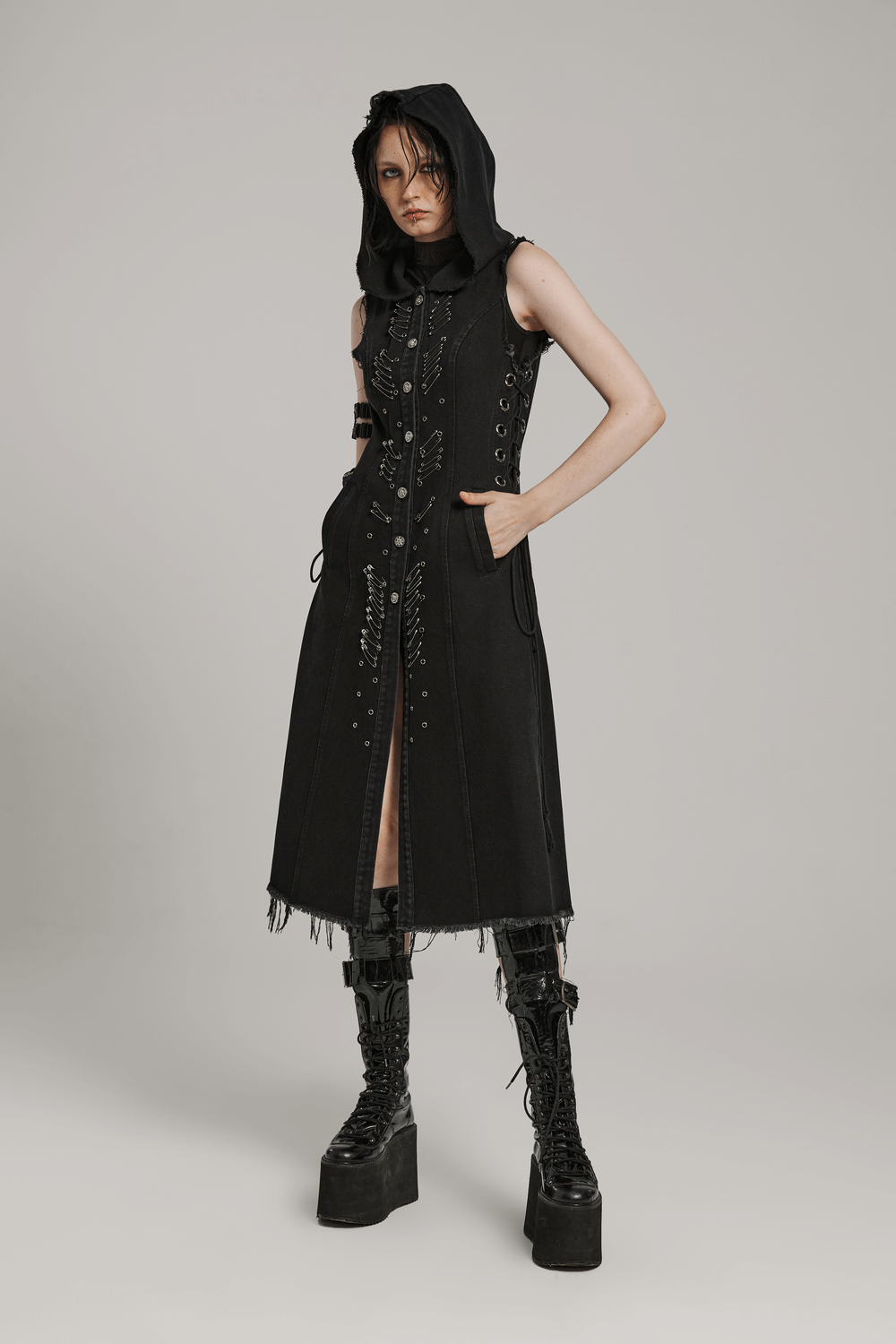 Denim hooded cape with punk safety pins, raw edge, adjustable fit, edgy fashion statement.