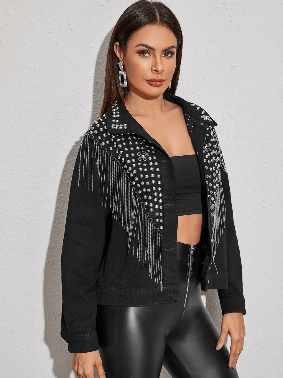 Stylish women's black denim jacket with tassels and rhinestones, perfect for casual streetwear looks.
