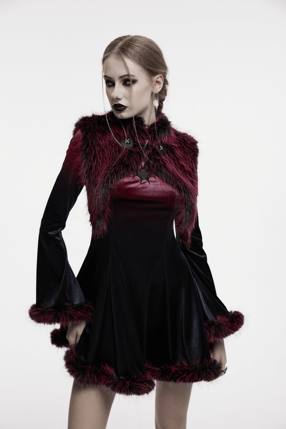 Devil fur cape dress with stand collar and leather details, featuring a dual tone design and a unique horn motif.