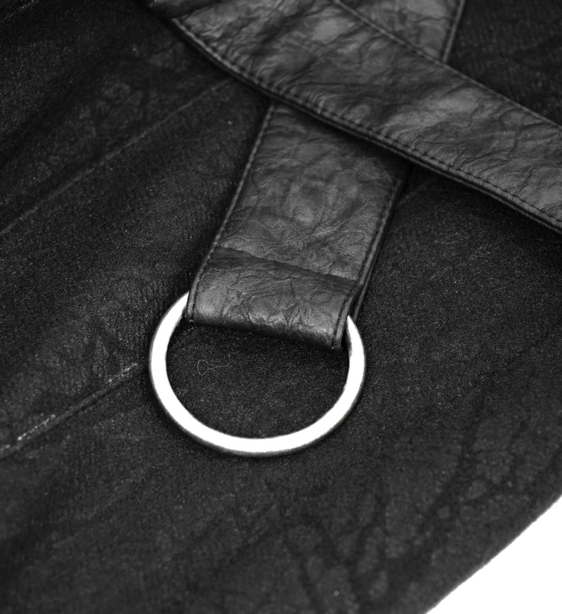 Close-up of a black leather strap featuring a silver ring detail on a men's gothic kilt skirt.