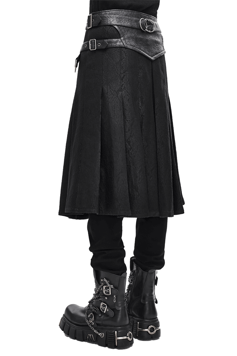 Men's black asymmetric kilt skirt with buckled leather straps and stylish boots, showcasing a gothic aesthetic.