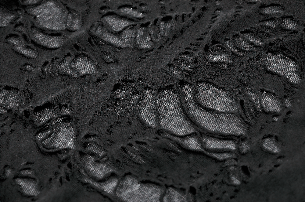 Close-up of distressed black fabric showcasing gothic lace-up design and raw edges for edgy punk fashion.