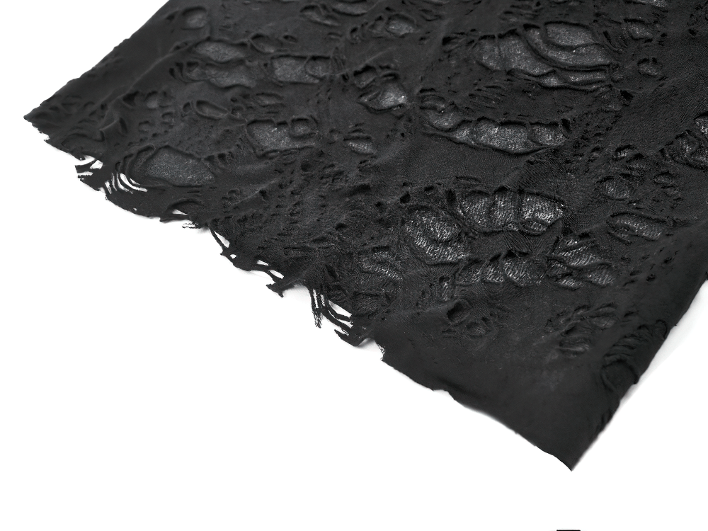 Close-up of distressed black fabric with shredded texture, perfect for punk and gothic fashion