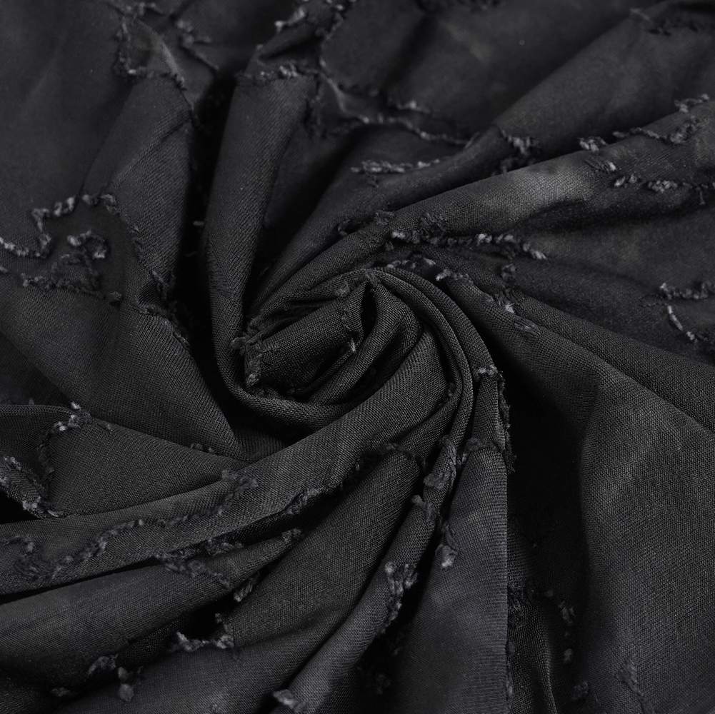 Distressed black fabric showcasing unique texture and eyelet details for a stylish sleeveless top.