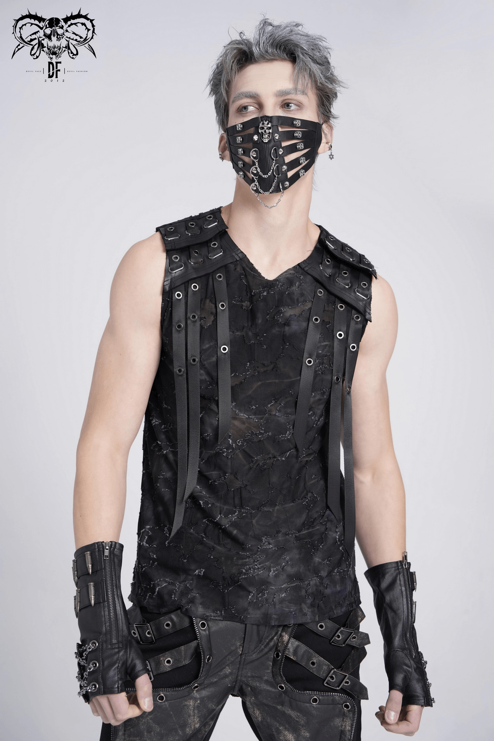 Trendy distressed black sleeveless top with eyelet strap details, paired with edgy accessories and a matching mask.