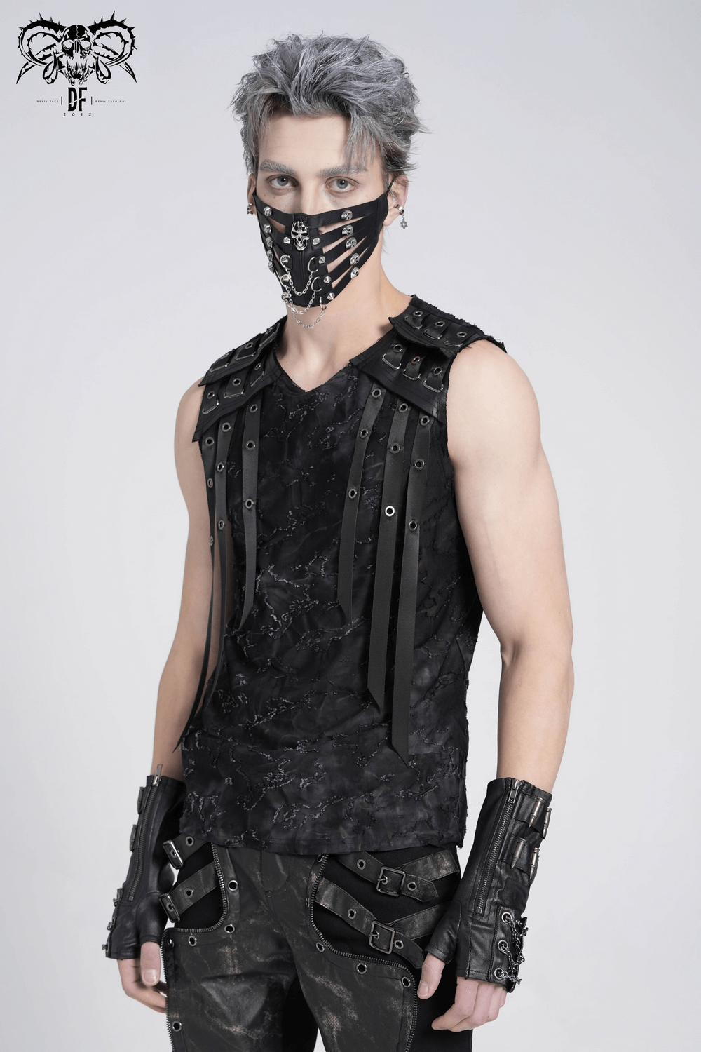 Distressed black sleeveless top with eyelet straps, styled with edgy accessories and a matching mask.