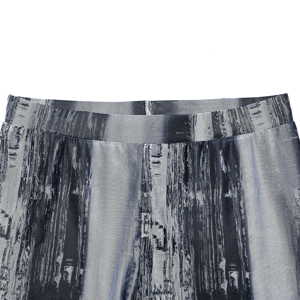 Close-up of Distressed Cyberpunk Leggings showcasing unique mesh texture and post-apocalyptic print style.