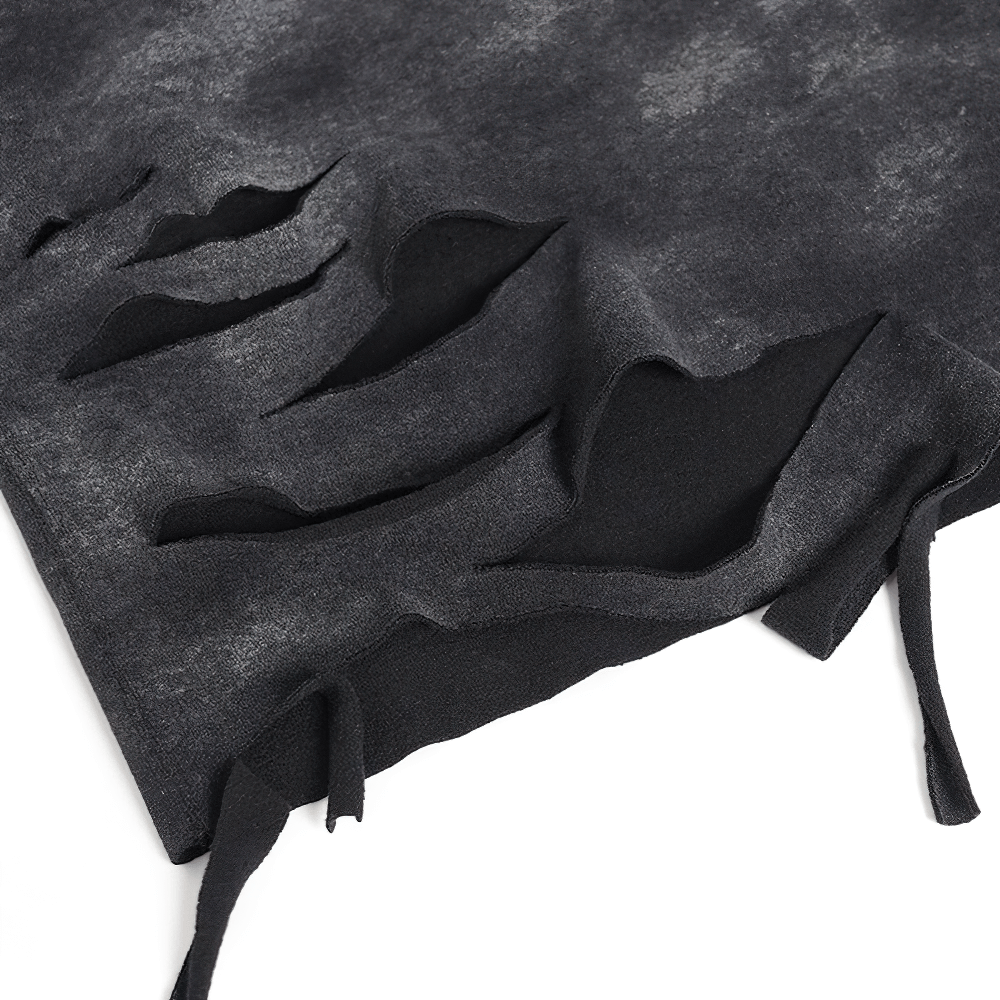Close-up of rips and ties on a distressed black tee, showcasing edgy grunge details for alternative fashion.
