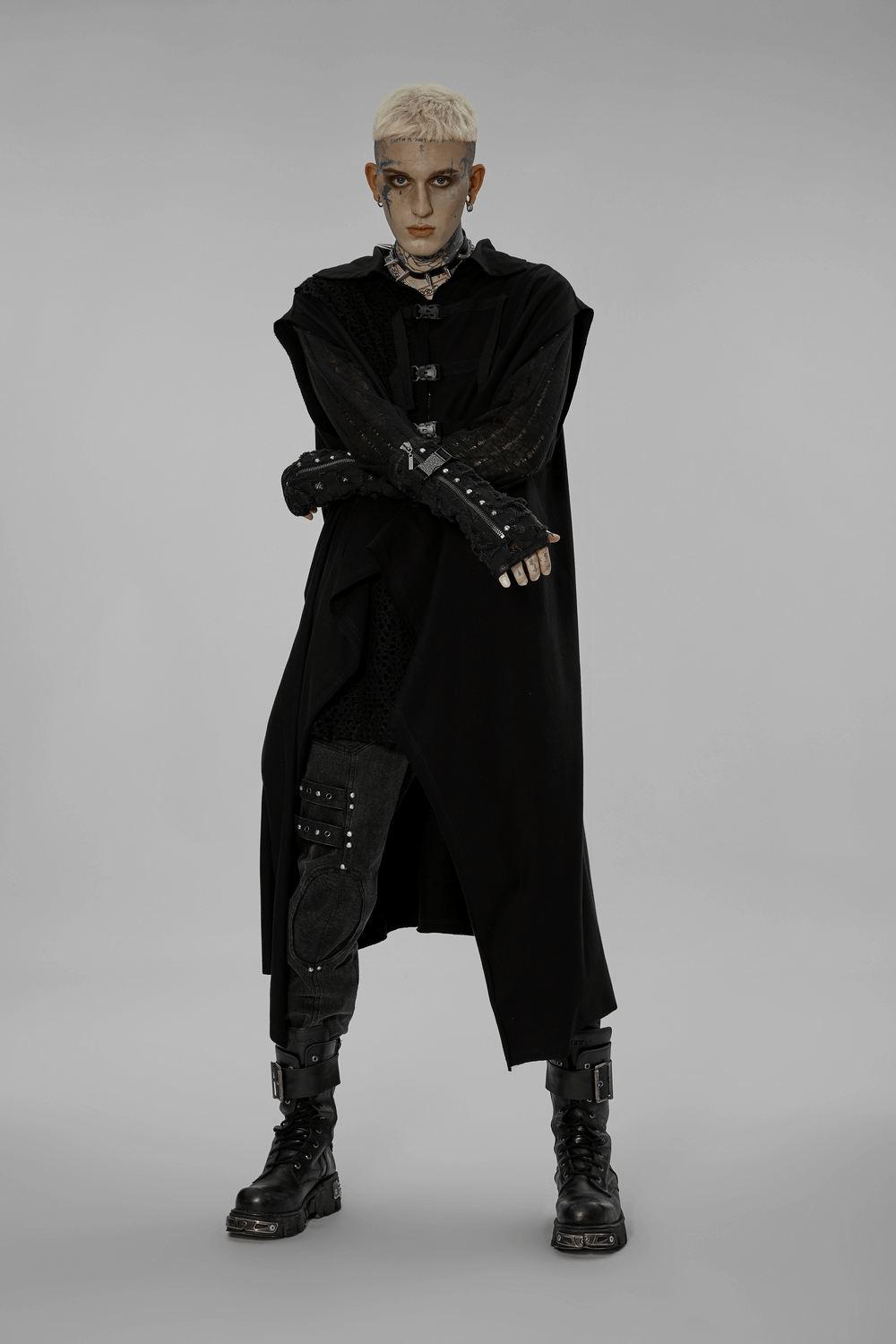 Model showcasing distressed denim punk arm gloves with gauze, exuding edgy fashion and confidence.