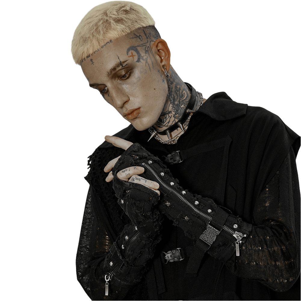 Punk-inspired model wearing ripped denim fingerless gloves with gauze and metal buckles, exuding edgy style.
