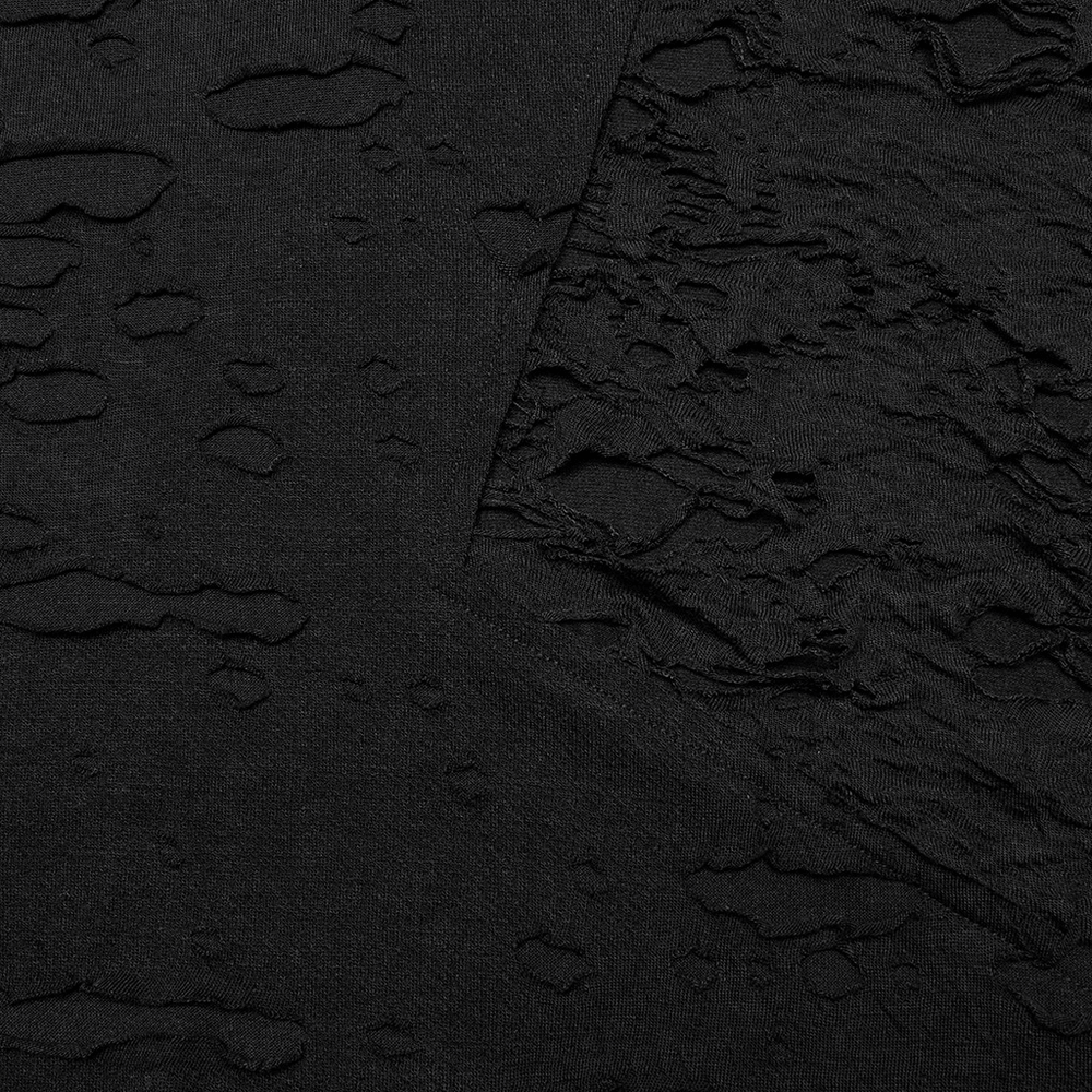 Close-up of distressed gothic knit top fabric showcasing tattered textures and diagonal splicing for a layered punk-inspired look.