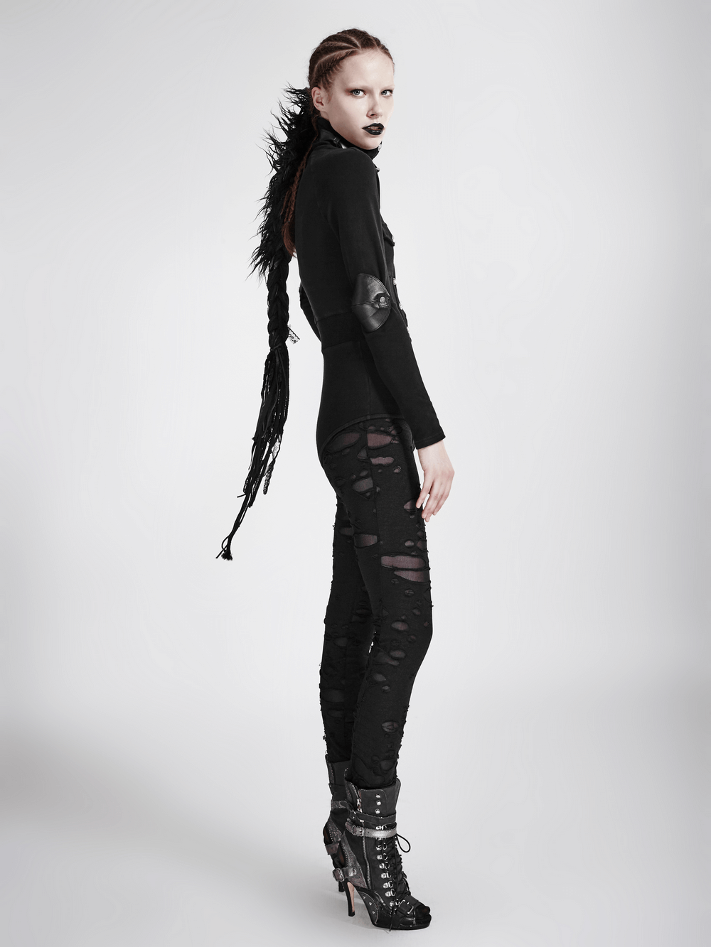 Gothic distressed mesh-panel leggings for women, styled with a chic black top and edgy accessories.