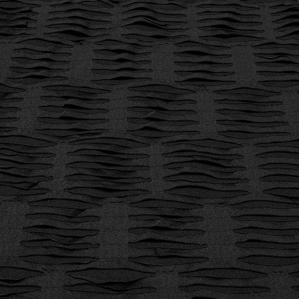 Close-up of distressed black fabric showcasing textured waves, perfect for gothic punk fashion.