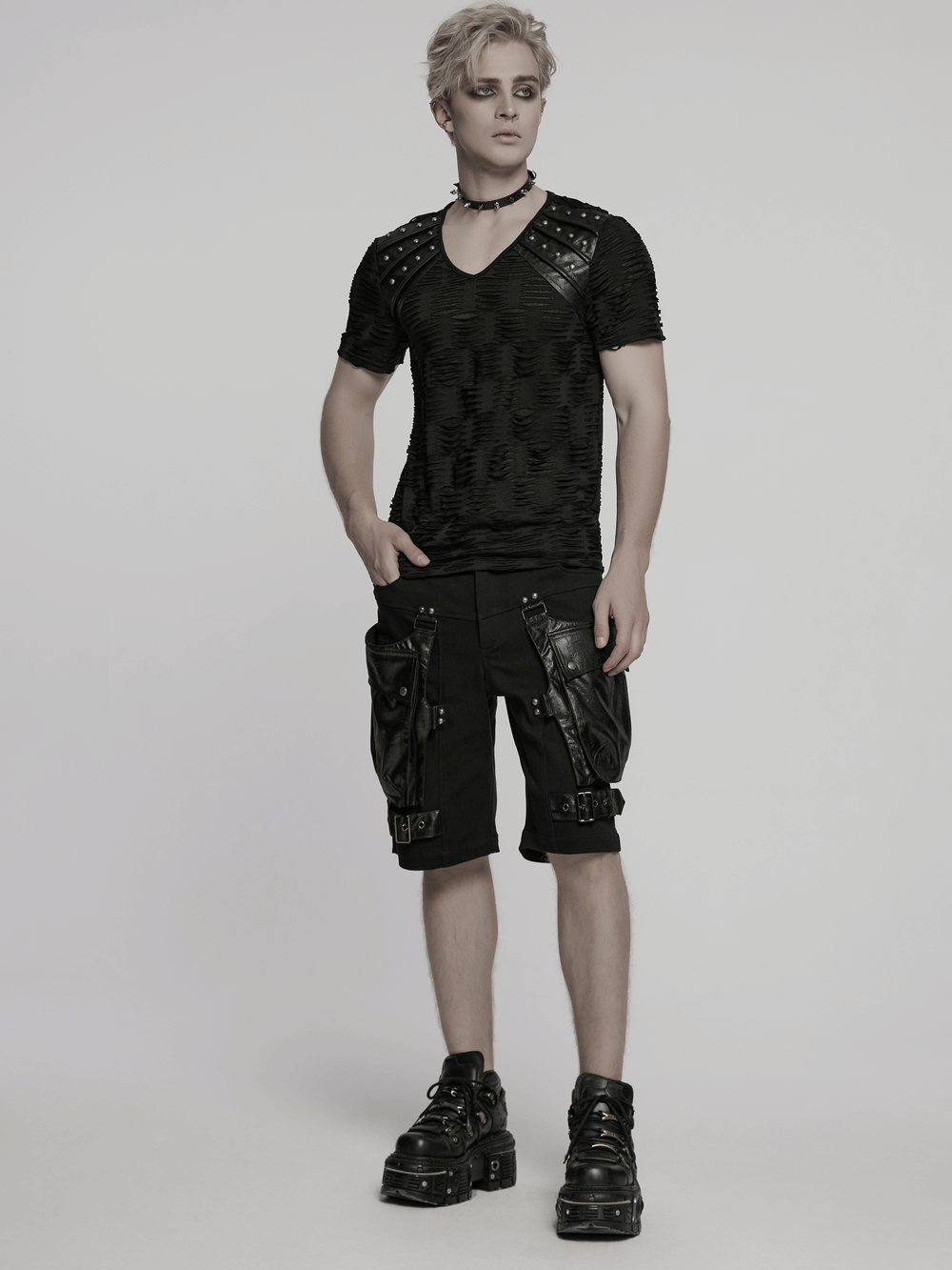 Distressed gothic T-shirt with rivet shoulder detail, paired with edgy cargo shorts for a bold punk look.
