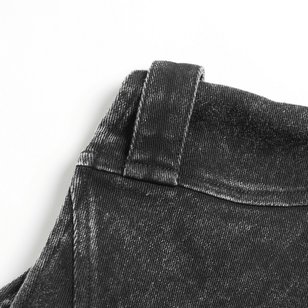 Close-up of the buckle strap detail on the Distressed Gothic Vest With Buckle Strap Detail.