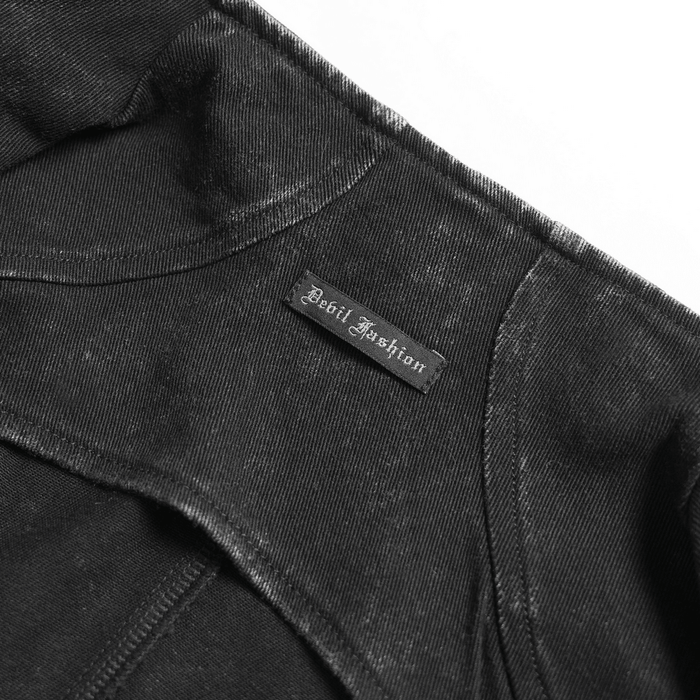 Close-up of the label on the Distressed Gothic Vest With Buckle Strap Detail by Devil Fashion.