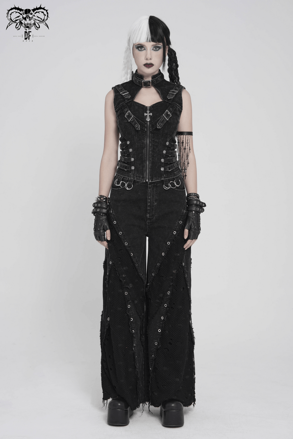 Distressed Gothic Vest With Buckle Strap Detail worn with matching black pants and edgy accessories, showcasing punk style.