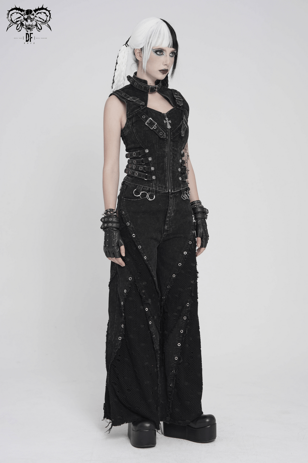 Distressed Gothic Vest With Buckle Strap Detail worn with matching black pants and accessories, showcasing punk fashion style.