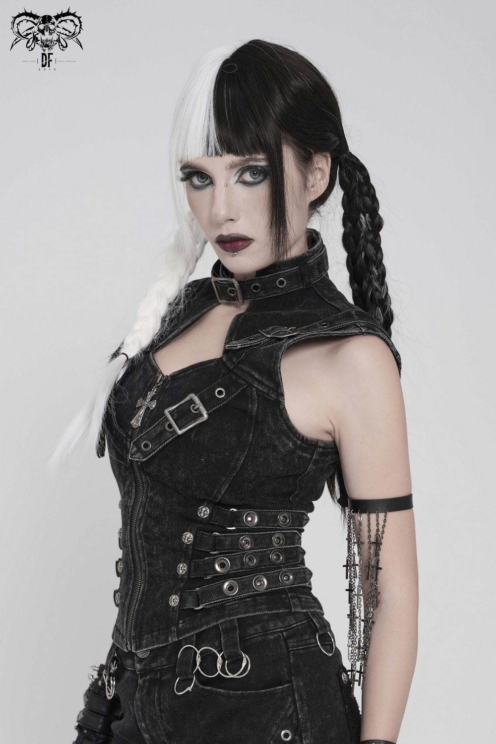 Distressed Gothic Vest With Buckle Strap Detail worn by model with striking hair in black and white, showcasing punk style.