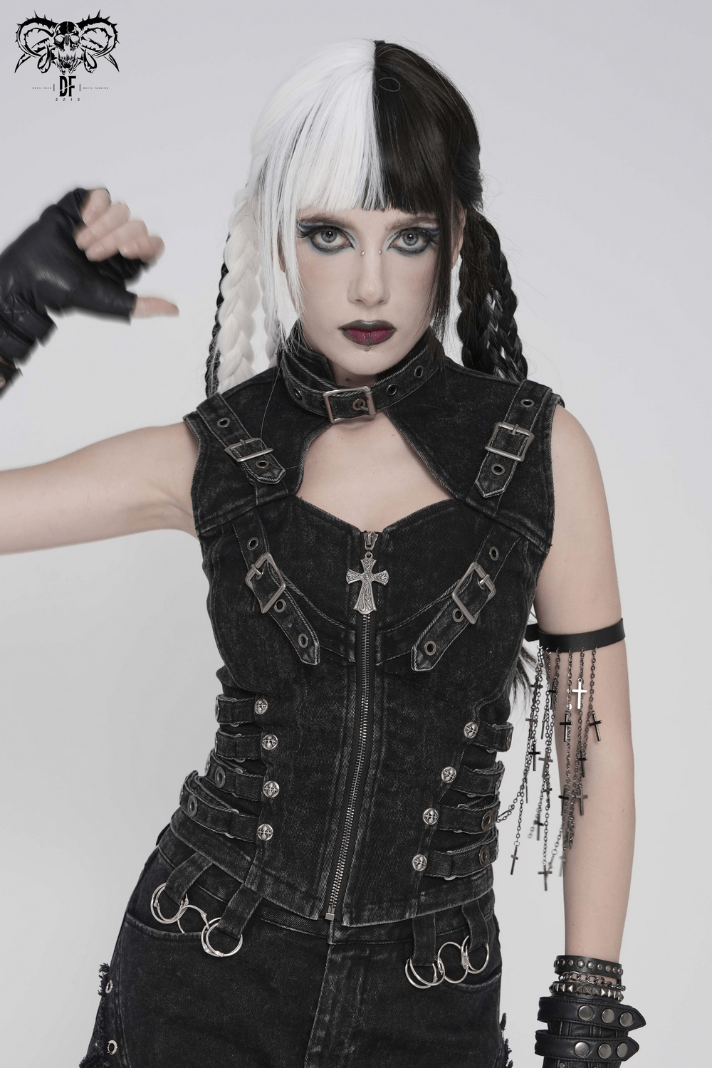 Distressed Gothic Vest With Buckle Strap Detail worn by model with dual-tone hair, showcasing punk style and industrial edge.