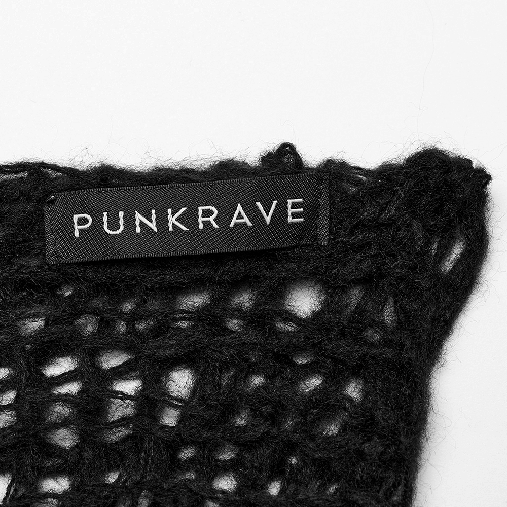 Close-up of PUNK RAVE label on a distressed mohair sweater showcasing edgy design and texture.