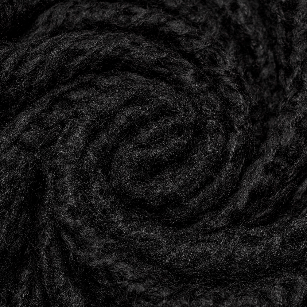Close-up of soft, dark mohair fabric showcasing luxurious texture and depth for a pullover sweater.