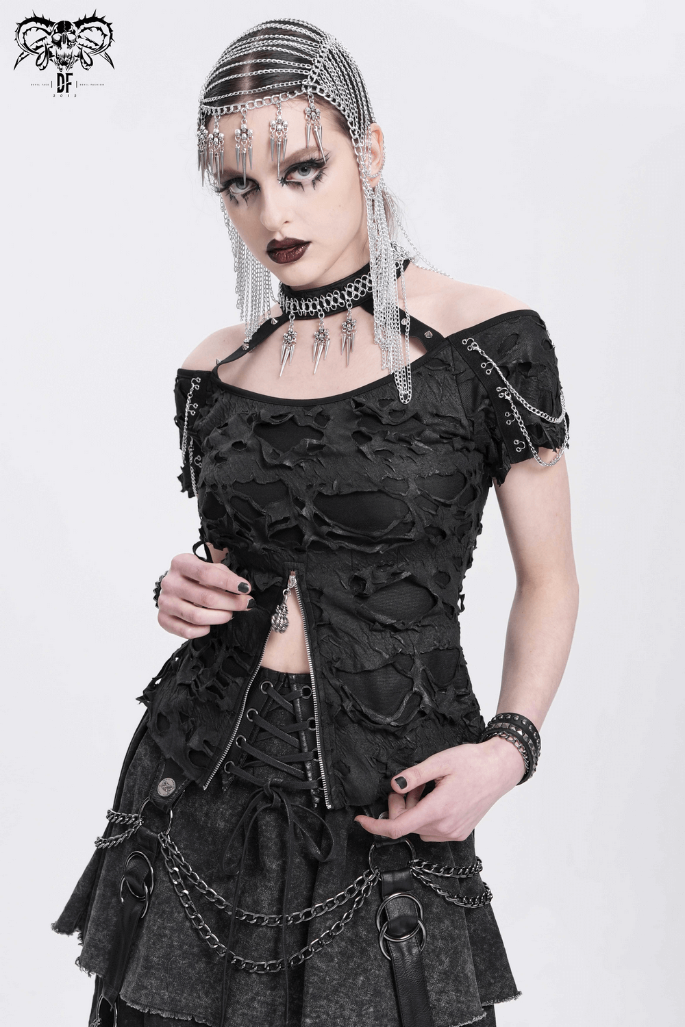 Edgy distressed off-shoulder top with chains and zipper detail, perfect for punk and gothic styles.