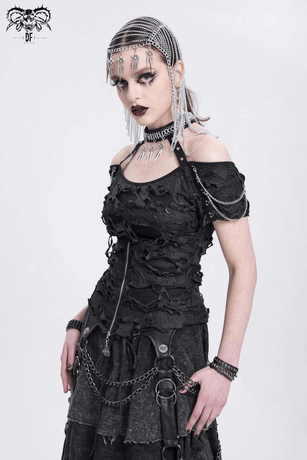 Punk ripped off-shoulder top with chains and zipper, embodying rebellious gothic fashion.