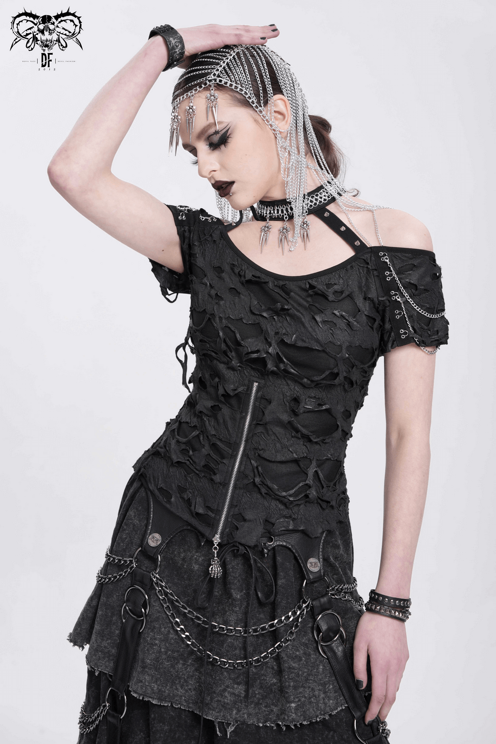 Distressed off-shoulder punk top with chains, zipper, and harness straps in an edgy gothic style.