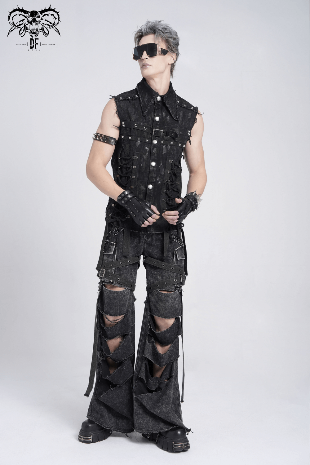 Male model showcasing distressed punk flare pants with chains and ripped details, perfect for edgy fashion enthusiasts.