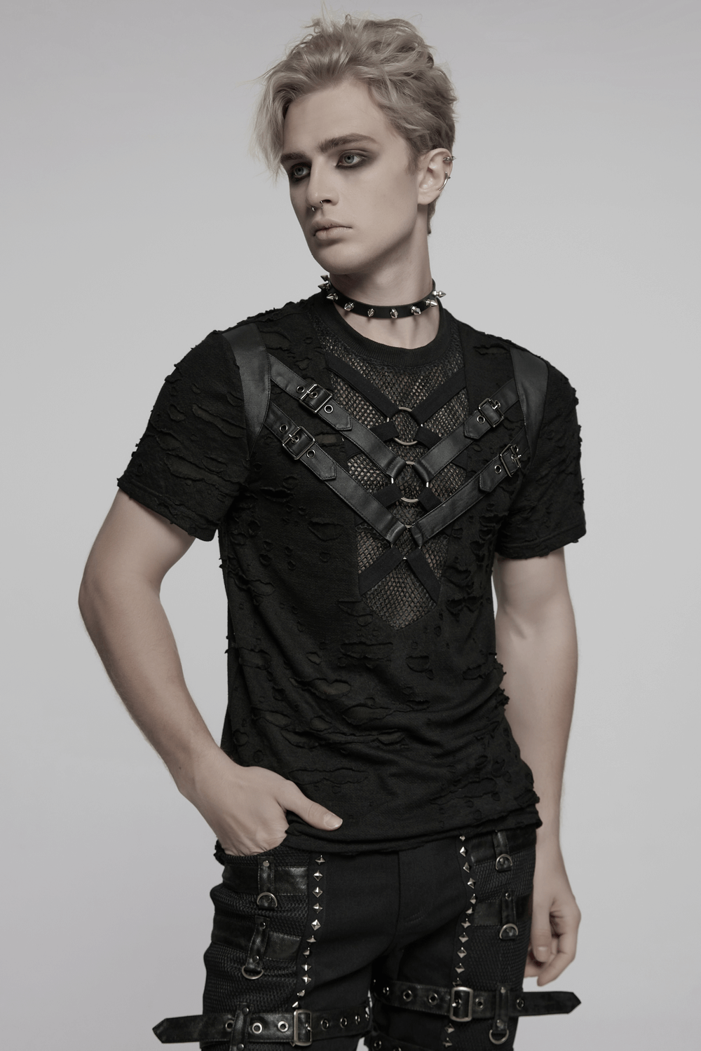 Edgy distressed punk t-shirt with leather straps and metal rings, perfect for a rebellious look.