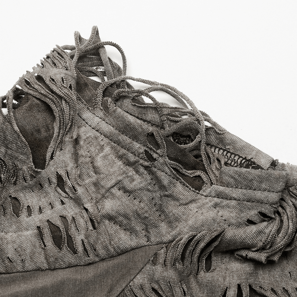 Close-up of distressed punk T-shirt showcasing unique tattered texture and edgy detailing for urban style.