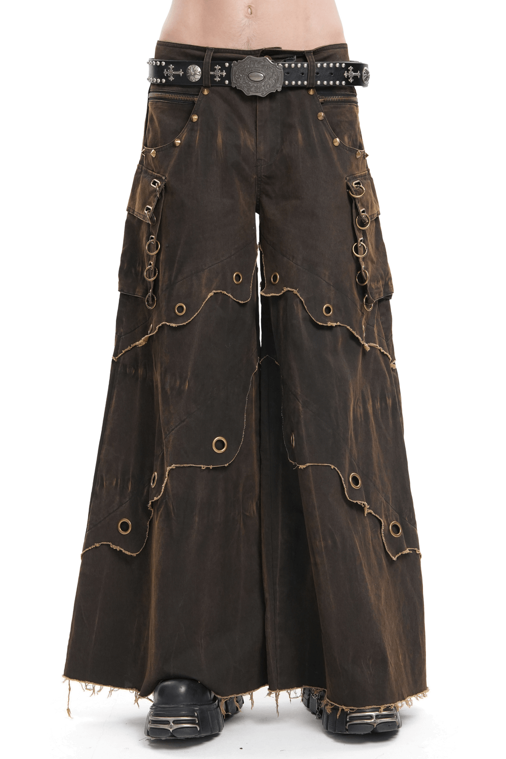 Distressed wide leg pants with grommet detailing, raw hem, and pockets in a dark wash for a bohemian style.
