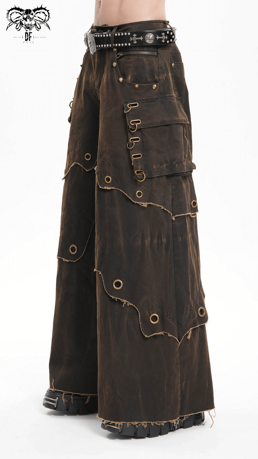 Distressed wide leg pants with grommets and raw hem, featuring pockets and edgy bohemian style. Perfect for festivals or casual wear.