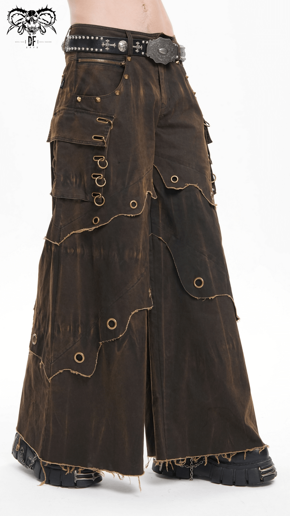 Distressed male wide-leg pants with grommets, tiered hem, and pockets, perfect for bohemian style.