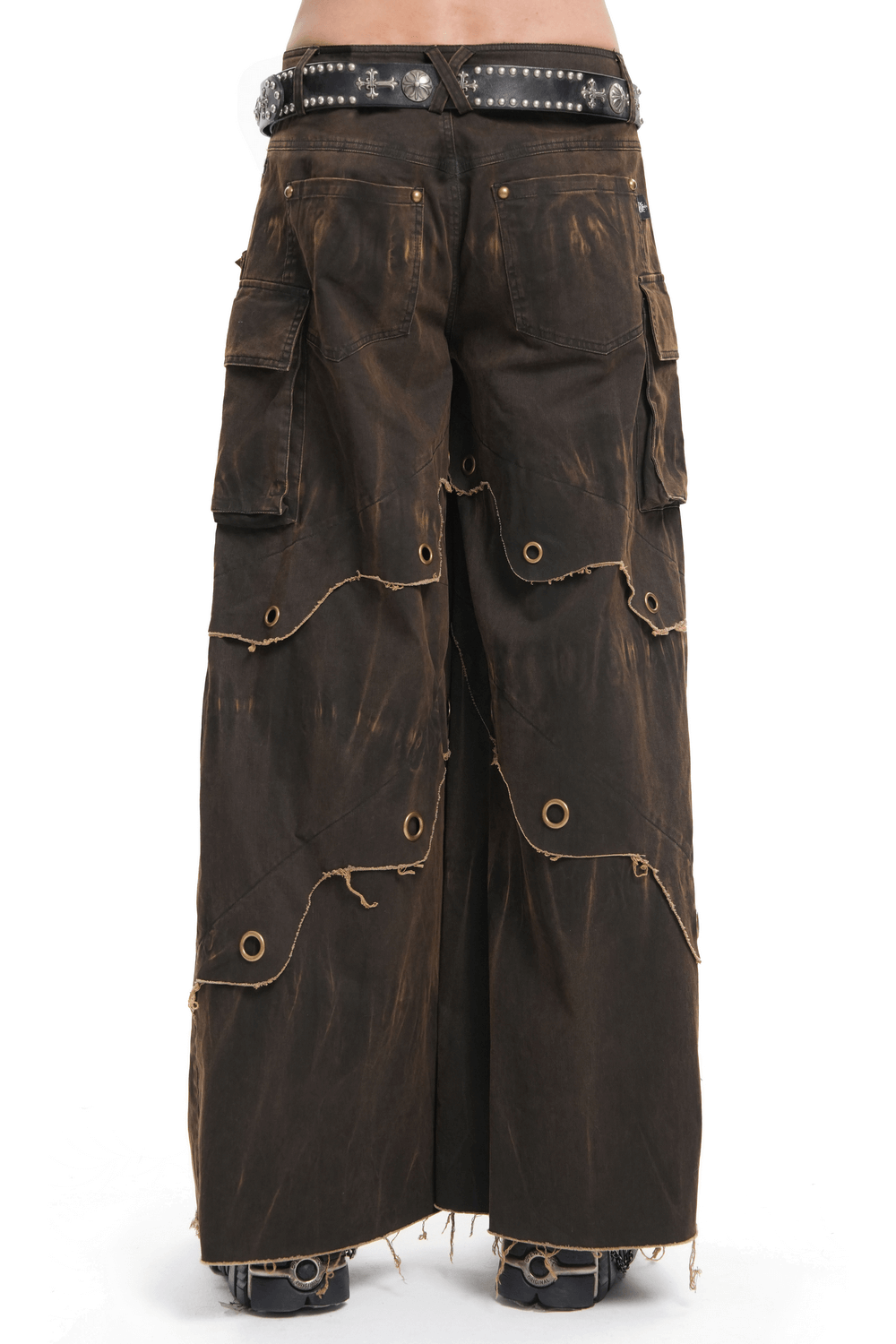 Distressed male wide-leg pants with grommets, tiered hem, and pockets, ideal for bohemian style and everyday wear.