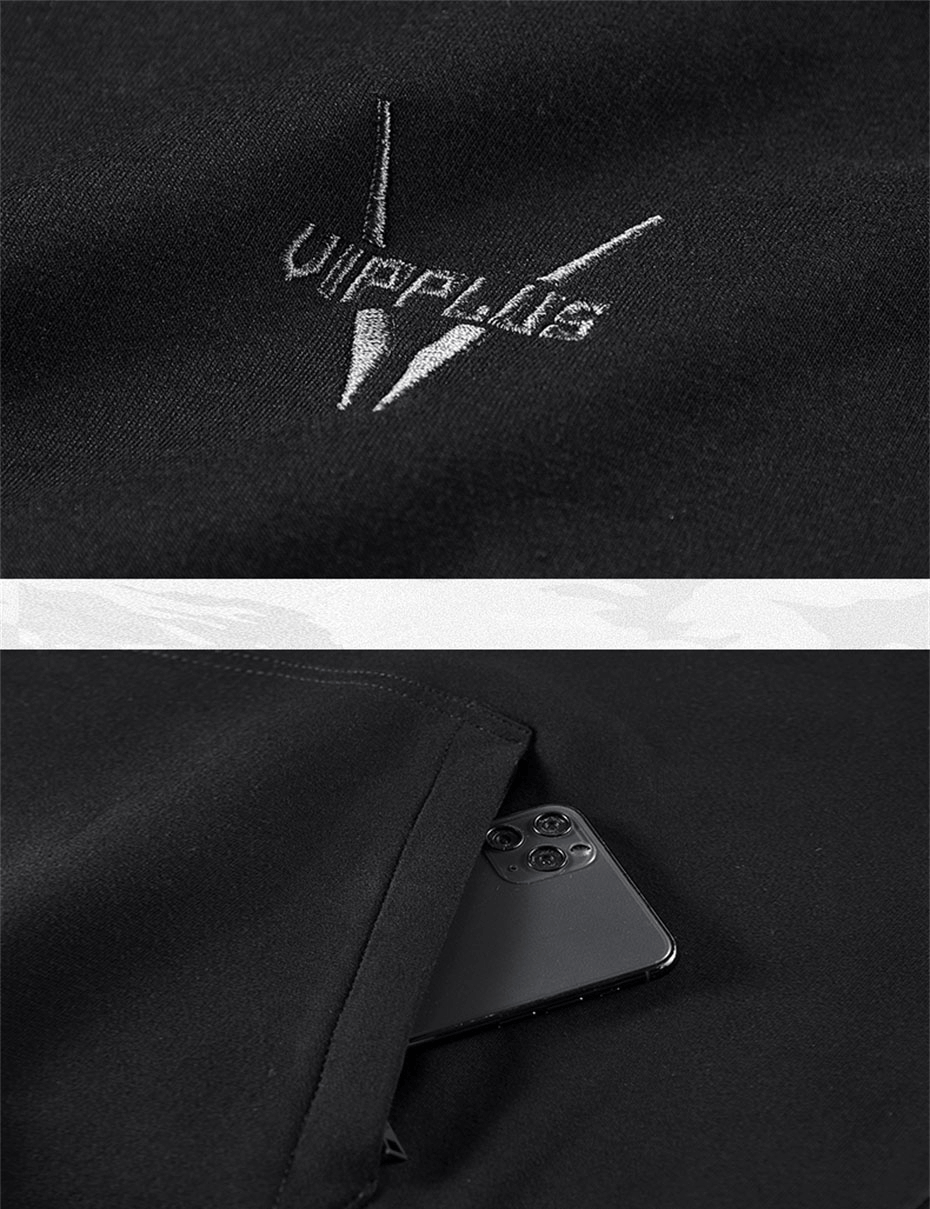 Close-up of double neckline unisex hoodie showing sleeve pocket and logo embroidery.