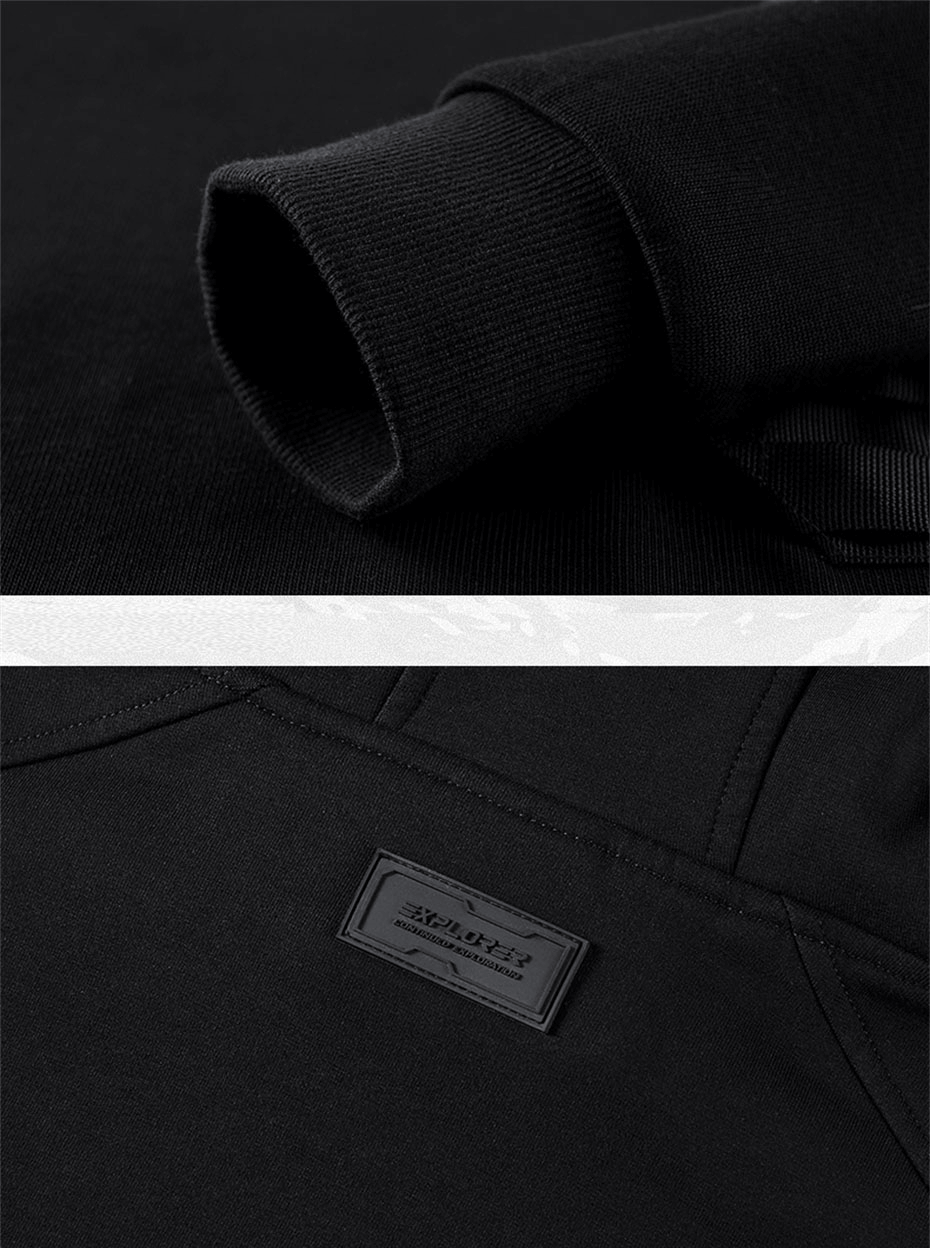 Close-up of black double neckline hoodie showcasing sleeve cuff and label, perfect for alternative fashion lovers.