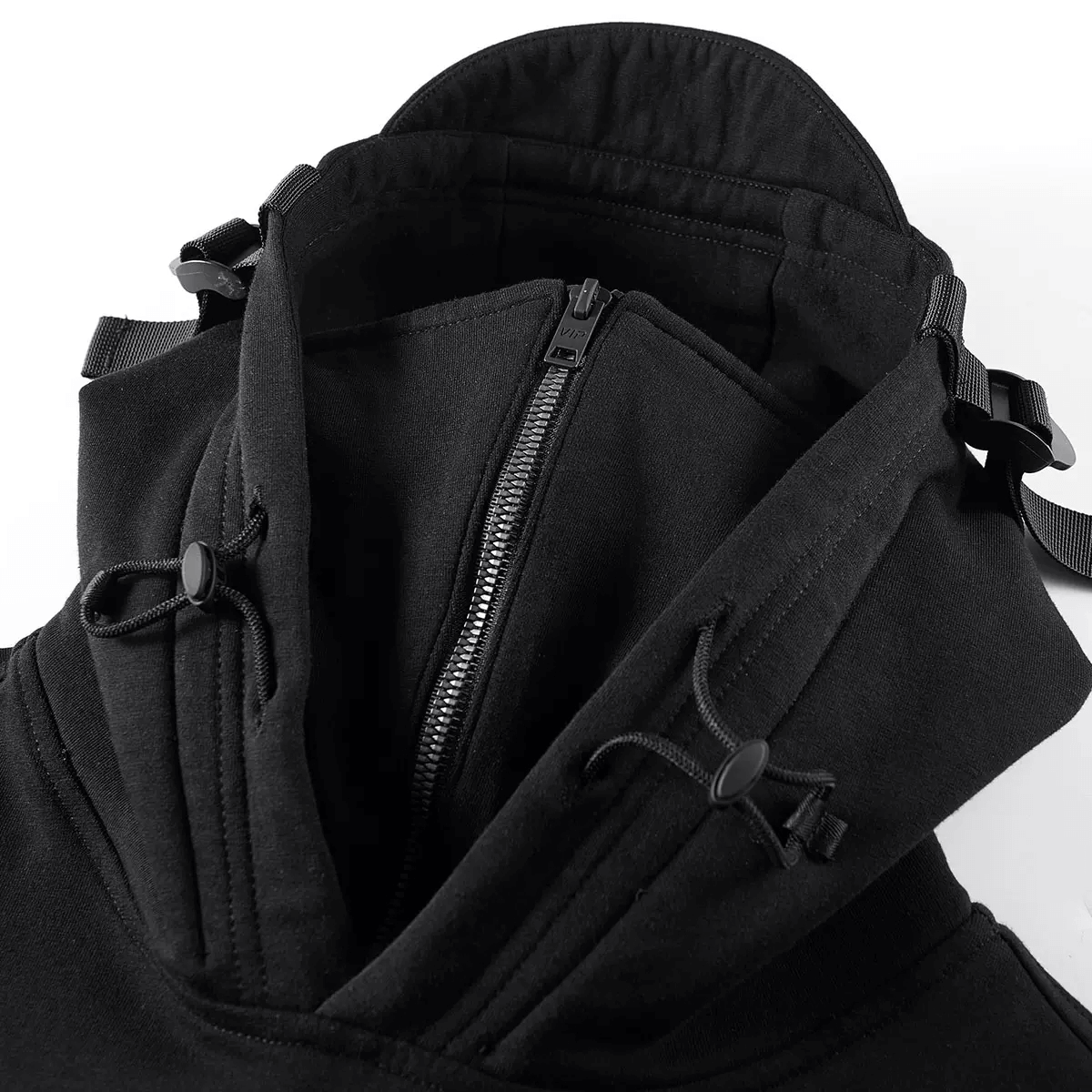 Close-up of a black double neckline hoodie featuring unique pocket zippers on the sleeves, showcasing alternative fashion design.