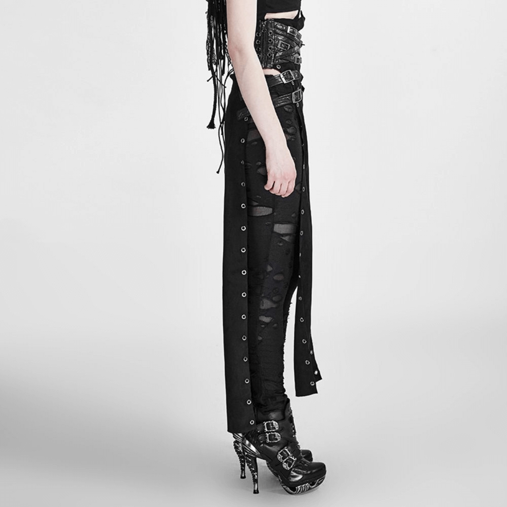 Side view of a double-sided punk skirt with high waist, metal eyelets, and daring split, styled with edgy shoes.