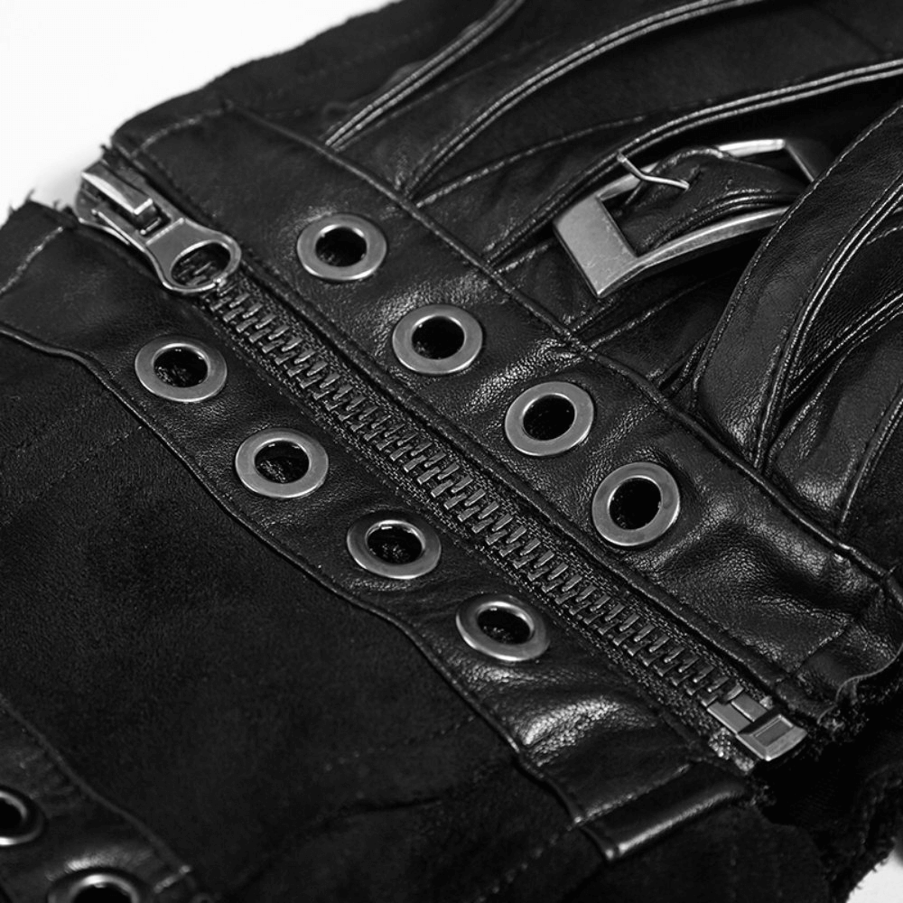 Close-up of metal eyelets and zipper details on a black punk skirt, showcasing edgy fashion elements.
