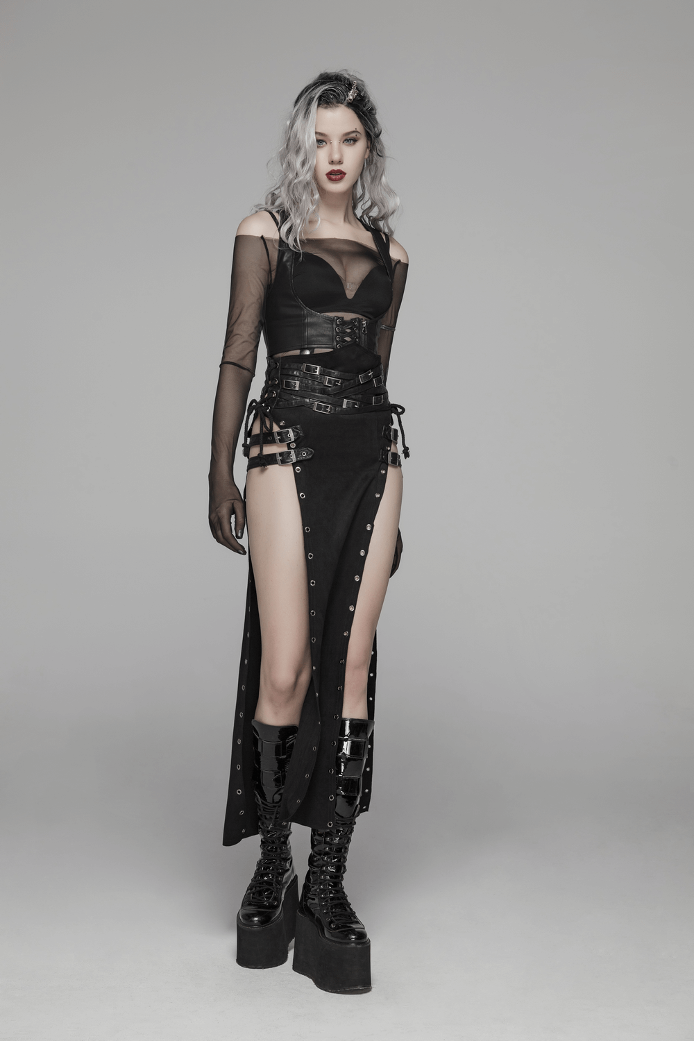 Model showcasing a double-sided split punk skirt with metal eyelets, high waist, and edgy attire, perfect for punk rock lovers.