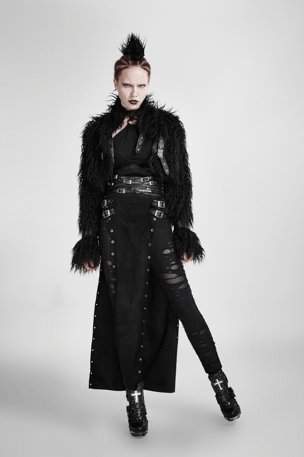 Model in a bold double-sided punk skirt with metal eyelets, showcasing edgy style and fierce attitude.