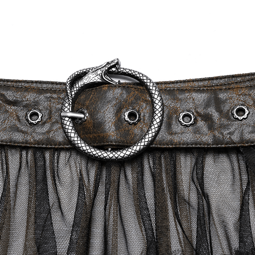 Close-up of a cracked faux leather belt featuring a unique snake head buckle and stylish mesh skirt details.