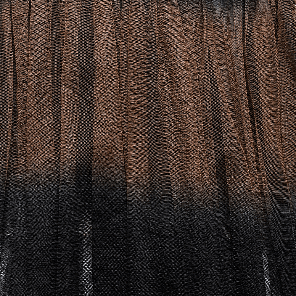 Close-up of dramatic layered mesh fabric in gradient shades, showcasing a bold and edgy design for skirts.