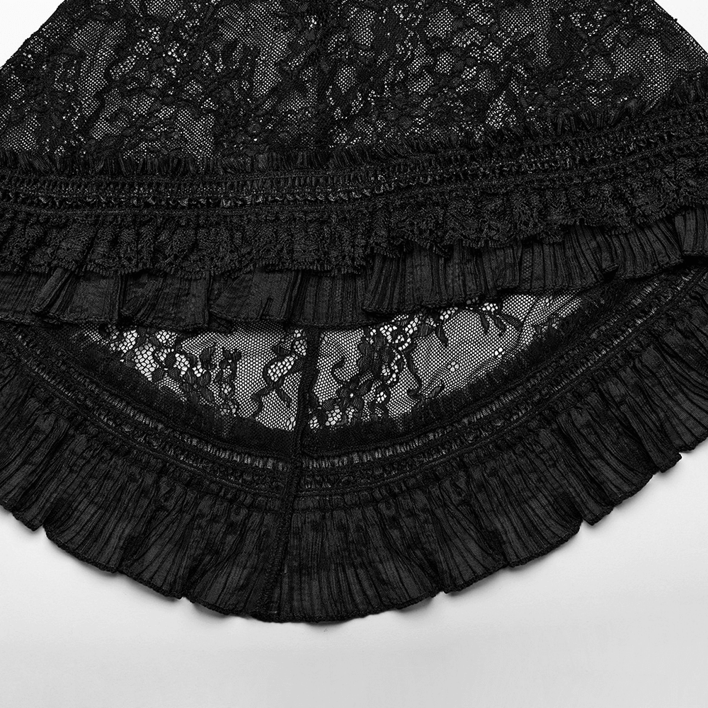 Intricate black lace fabric with ruffled trim, showcasing gothic elegance and dark fashion.