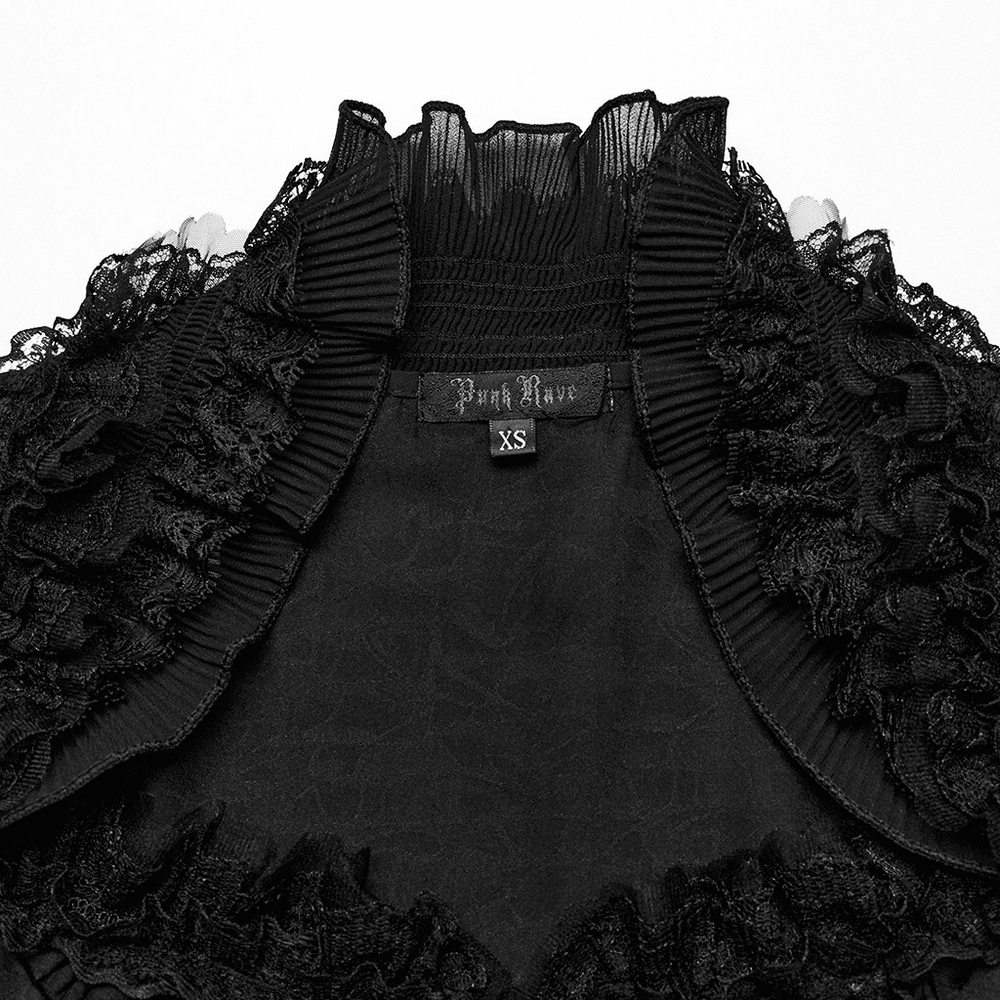 Close-up of a dramatic black lace blouse neckline with ruffles and a tag for Punk Rave in size XS.